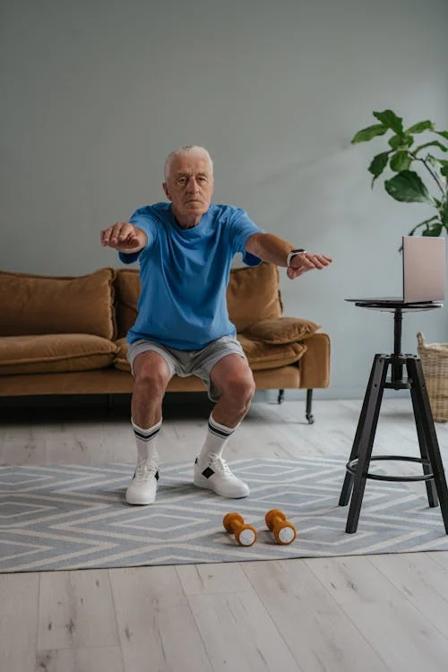 man doing squats at home